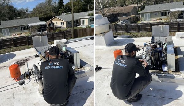HVAC technician servicing rooftop air conditioning unit on a residential building